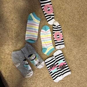Kids socks worn. Colorful striped ones are new. Other have slight discolor